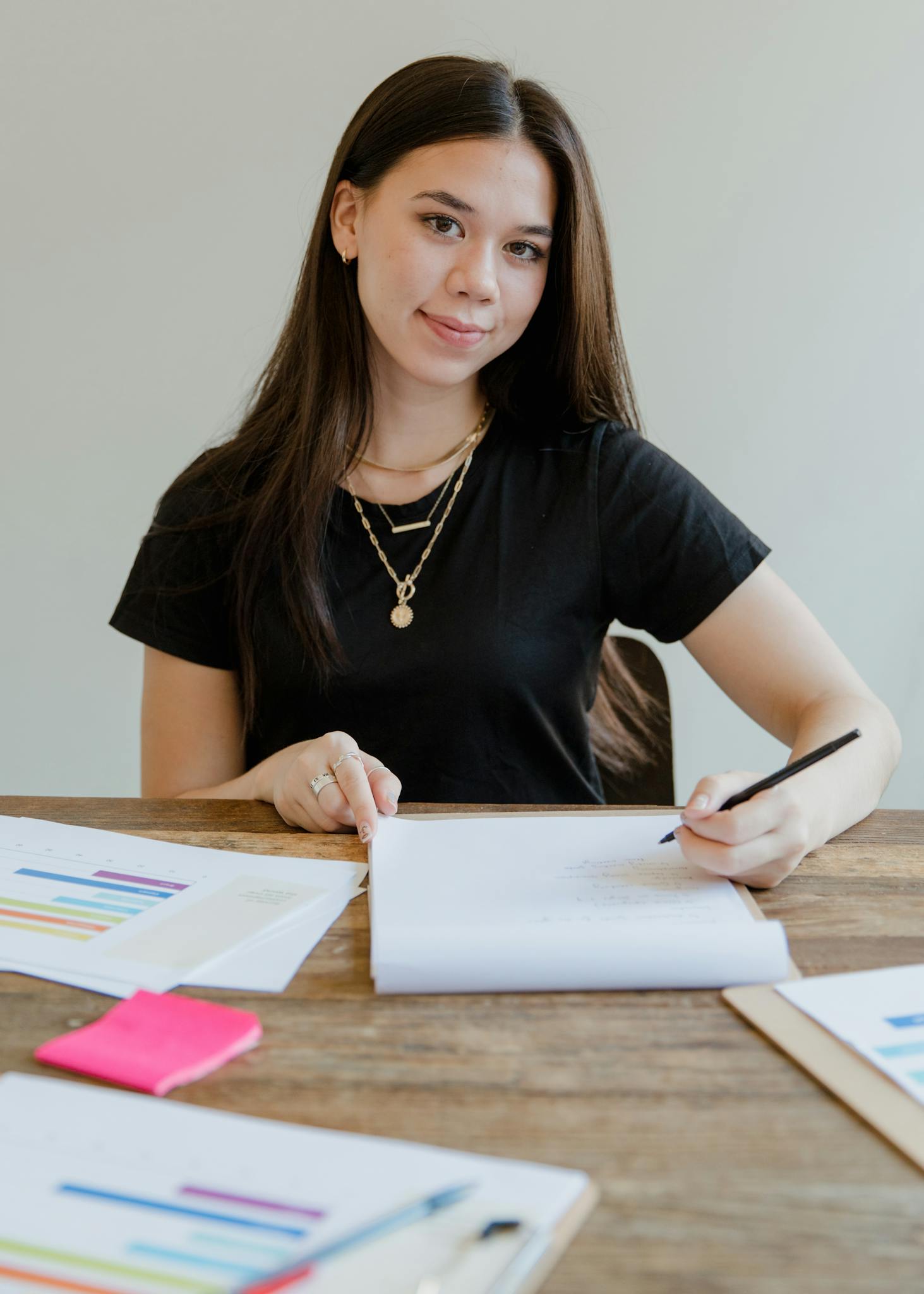 a woman in black shirt sitting at